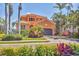 Beautiful two-story home featuring a lush, landscaped yard and a two-car garage at 6211 Legends Blvd, Bradenton, FL 34210