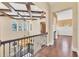 An expansive foyer with high ceilings, exposed wood beams, and a decorative chandelier at 6211 Legends Blvd, Bradenton, FL 34210