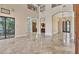 Bright and open living room with tile floors, high ceilings, and seamless flow to other spaces at 6211 Legends Blvd, Bradenton, FL 34210