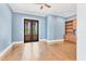 Bright office space with hardwood floors, built-in shelving, and stylish double door entry at 6211 Legends Blvd, Bradenton, FL 34210