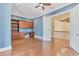 Well-lit office with hardwood floors, ceiling fan, custom built-ins, and ample storage space at 6211 Legends Blvd, Bradenton, FL 34210