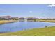 Picturesque pond view of the neighborhood with fountain and lush greenery; a serene landscape enhancing the community's appeal at 6211 Legends Blvd, Bradenton, FL 34210