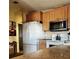 Bright kitchen features a stainless steel microwave, ample cabinet space, and open concept at 705 Riverview Cir, North Port, FL 34287