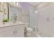 Bathroom with a modern vanity, walk-in shower with glass doors, and bright lighting at 9487 Tequila Sunrise Dr, Sarasota, FL 34241