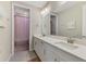 Beautiful bathroom featuring a double sink vanity with quartz countertops and modern fixtures at 9487 Tequila Sunrise Dr, Sarasota, FL 34241