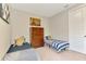 Comfortable bedroom with twin beds and neutral decor at 9487 Tequila Sunrise Dr, Sarasota, FL 34241
