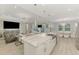 Spacious kitchen island with stainless steel sink overlooking the open-concept living and dining areas at 9487 Tequila Sunrise Dr, Sarasota, FL 34241