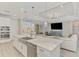 Bright, spacious kitchen with a large island, stainless steel appliances, and seamless flow to the living area at 9487 Tequila Sunrise Dr, Sarasota, FL 34241