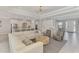 Spacious living room flowing into the kitchen, featuring stylish decor and abundant natural light at 9487 Tequila Sunrise Dr, Sarasota, FL 34241