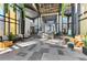 Bright community lobby featuring modern design, ample seating, and contemporary finishes at 9487 Tequila Sunrise Dr, Sarasota, FL 34241