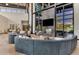 Comfortable lounge area with stylish seating, fireplace, and views of the pool at 9487 Tequila Sunrise Dr, Sarasota, FL 34241