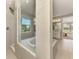 Bright bathroom features a tub and tiled walk-in shower, adjacent to the Main Bedroom at 9487 Tequila Sunrise Dr, Sarasota, FL 34241