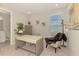 Office space has a neutral palate with a cozy chair, desk, and natural light at 9487 Tequila Sunrise Dr, Sarasota, FL 34241