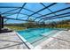 The pool area features a pool, hot tub, and screened enclosure at 9487 Tequila Sunrise Dr, Sarasota, FL 34241