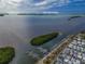 Aerial view of Anna Maria Island showcasing waterfront homes, Longboat Pass, and community amenities at 10315 Cortez W Rd # 16E, Bradenton, FL 34210