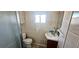Functional bathroom with a glass-enclosed shower and a corner vanity, designed for efficient use of space at 10315 Cortez W Rd # 16E, Bradenton, FL 34210
