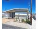 Charming single-story home with well-maintained landscaping and cozy outdoor living space at 10315 Cortez W Rd # 16E, Bradenton, FL 34210