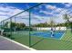 Active pickleball court with players in action, showcasing the community's recreational amenities and vibrant, social atmosphere at 10315 Cortez W Rd # 16E, Bradenton, FL 34210