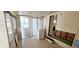 Sunroom needing repair with washer hookups and an exterior door with window at 10315 Cortez W Rd # 16E, Bradenton, FL 34210