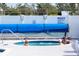 Relaxing spa area featuring spa rules, seating, and overhead protection from the sun at 10315 Cortez W Rd # 16E, Bradenton, FL 34210