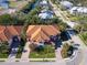 Aerial view of house highlighting the lush landscaping and beautiful terracotta roof at 12518 Harbour Landings Dr, Cortez, FL 34215