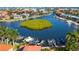 Aerial view of waterfront homes with private boat docks, creating a community of luxury at 12518 Harbour Landings Dr, Cortez, FL 34215