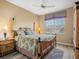 Bright bedroom featuring a bamboo-style bed frame and a large window with natural light at 12518 Harbour Landings Dr, Cortez, FL 34215