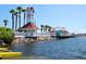 Picturesque waterfront view featuring a clock tower, pier, and waterfront buildings at 12518 Harbour Landings Dr, Cortez, FL 34215