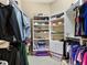 Walk-in closet featuring ample storage space, shelving, and organized clothing racks at 12518 Harbour Landings Dr, Cortez, FL 34215
