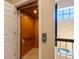 Interior view of a residential elevator with wood paneling and easy access at 12518 Harbour Landings Dr, Cortez, FL 34215