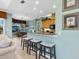 Kitchen with bar seating and an open view to the breakfast nook at 12518 Harbour Landings Dr, Cortez, FL 34215