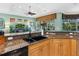 Functional kitchen featuring a double sink and adjacent living area at 12518 Harbour Landings Dr, Cortez, FL 34215