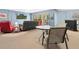 Relaxing living room featuring a seating area, bar, and a sliding door to the outdoors at 12518 Harbour Landings Dr, Cortez, FL 34215