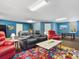 Spacious recreation room with comfortable furniture, ping pong table, and neutral carpeting at 12518 Harbour Landings Dr, Cortez, FL 34215