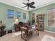 Well-lit home office with a ceiling fan and natural accents at 12518 Harbour Landings Dr, Cortez, FL 34215