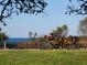 Scenic park view with a person on a bench, enjoying the waterfront and open sky at 12518 Harbour Landings Dr, Cortez, FL 34215