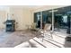 Covered patio with outdoor seating and a grill for relaxing and enjoying nature at 12518 Harbour Landings Dr, Cortez, FL 34215