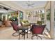 Covered porch with comfortable seating, perfect for outdoor relaxation and entertaining at 12518 Harbour Landings Dr, Cortez, FL 34215