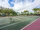 Well-maintained tennis court offering an active recreational space with beautiful surroundings at 12518 Harbour Landings Dr, Cortez, FL 34215
