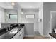 Bright bathroom featuring a walk-in shower with glass enclosure and dual sinks at 14147 Campfire Ct, Parrish, FL 34219