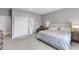 Spacious bedroom with a plush carpet, a sitting area and closet, providing a comfortable retreat at 14147 Campfire Ct, Parrish, FL 34219