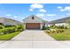 Beautiful home with a well-manicured lawn and a three car garage at 14147 Campfire Ct, Parrish, FL 34219