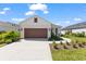 Charming single-Gathering home featuring a two-car garage, well manicured lawn and beautiful landscaping at 14147 Campfire Ct, Parrish, FL 34219