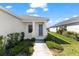 Charming home with a welcoming front porch and manicured landscaping at 14147 Campfire Ct, Parrish, FL 34219