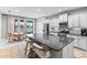 Bright kitchen features stainless appliances, granite countertops, and a large island with seating at 14147 Campfire Ct, Parrish, FL 34219