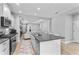 Modern kitchen features a large island, stainless steel appliances, and an open floor plan at 14147 Campfire Ct, Parrish, FL 34219
