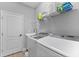 Well-equipped laundry room with modern appliances and ample storage at 14147 Campfire Ct, Parrish, FL 34219