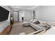 Cozy living room with a sectional sofa, area rug, and neutral decor at 14147 Campfire Ct, Parrish, FL 34219