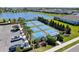 Overhead view of the pickleball courts available to residents and surrounded by lush landscaping at 14147 Campfire Ct, Parrish, FL 34219