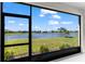 Expansive screened lanai featuring a beautiful water view at 14147 Campfire Ct, Parrish, FL 34219